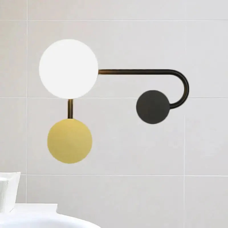 Modern black and gold planter sconce with white globe and gold sphere accents 110V light on Tampa Home & Garden Store