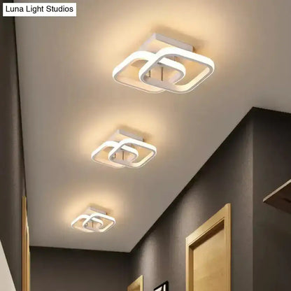 Black Gold Spiral Lamp ceiling light fixture; white square-ring LED trio lighting a hallway on Tampa Home & Garden Store