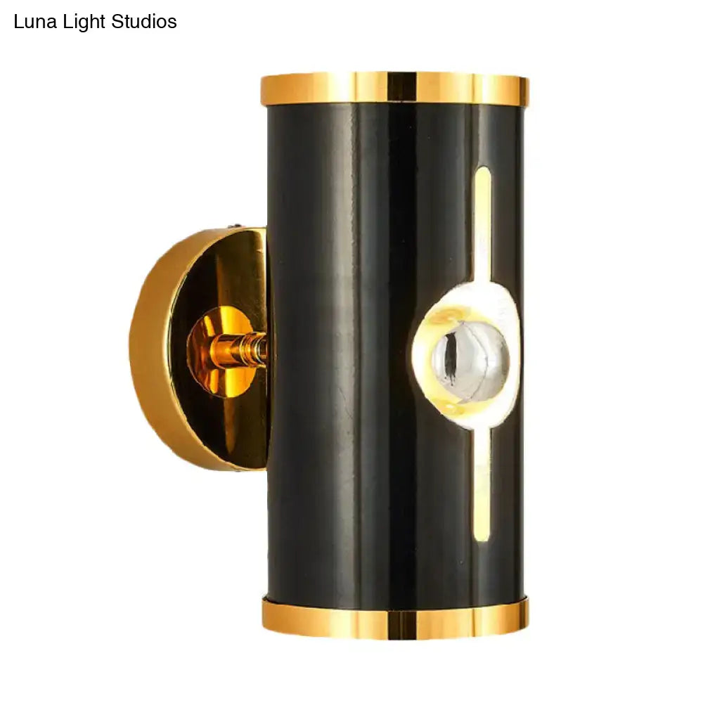 Black Vertical Wall Sconce by Decorbites, cylindrical black finish with gold trim on Tampa Home & Garden Store