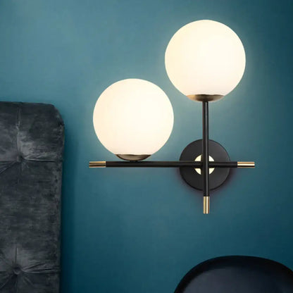 Black Milky Glass Sconce by Decorbites; dual milky-glass globes on a black metal wall mount on Tampa Home & Garden Store