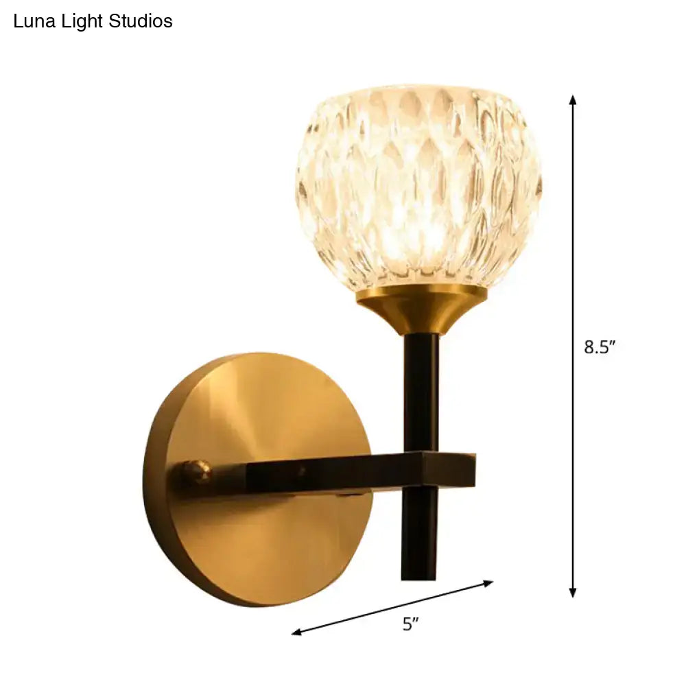 Gold dimpled glass sconce with brass finish backplate and black stem by Decorbites on Tampa Home & Garden Store