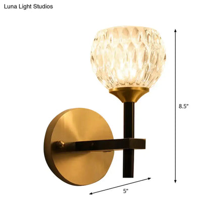 Gold dimpled glass sconce with brass finish backplate and black stem by Decorbites on Tampa Home & Garden Store