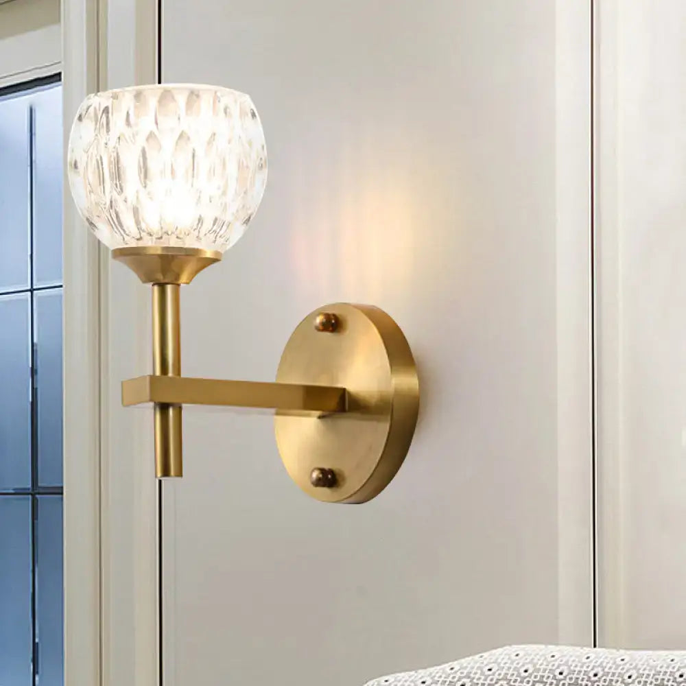 Gold dimpled glass sconce by Decorbites; brass wall light with glass shade on Tampa Home & Garden Store