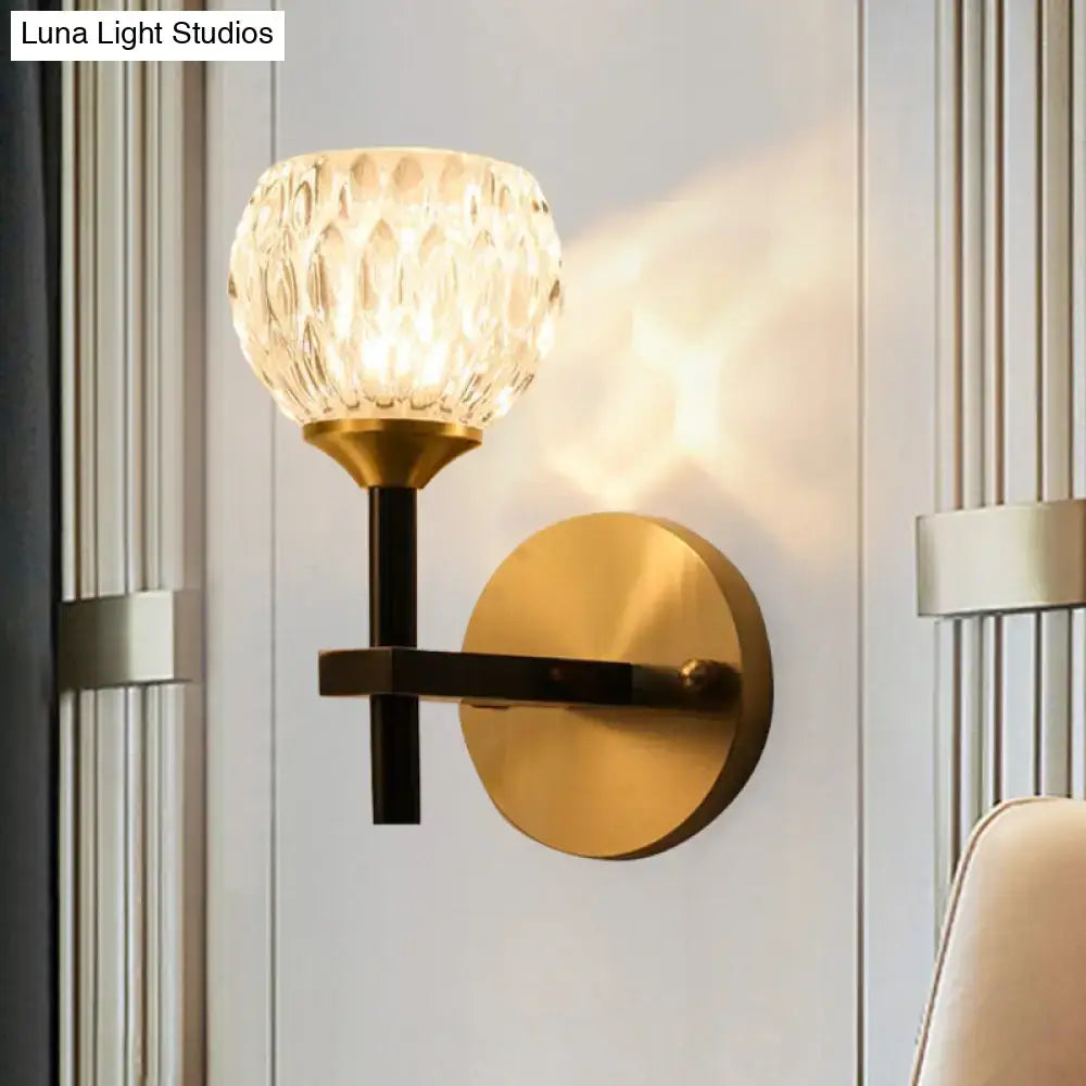 Decorbites gold dimpled glass sconce with brass round backplate and black stem on Tampa Home & Garden Store
