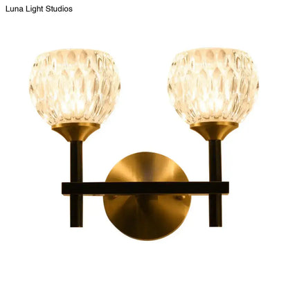 Gold dimpled glass sconce by Decorbites, two glass shades with brass backplate and black arms on Tampa Home & Garden Store