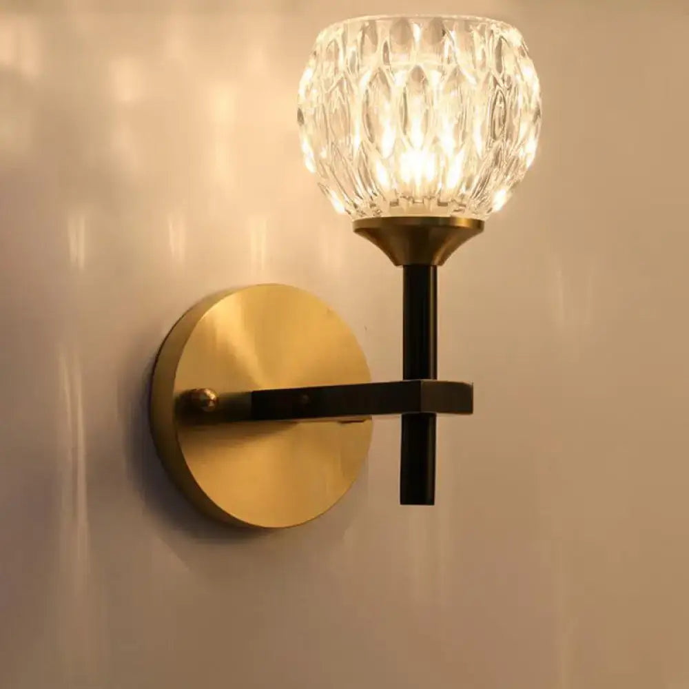 Gold dimpled glass wall sconce with brass mount and black stem by Decorbites on Tampa Home & Garden Store