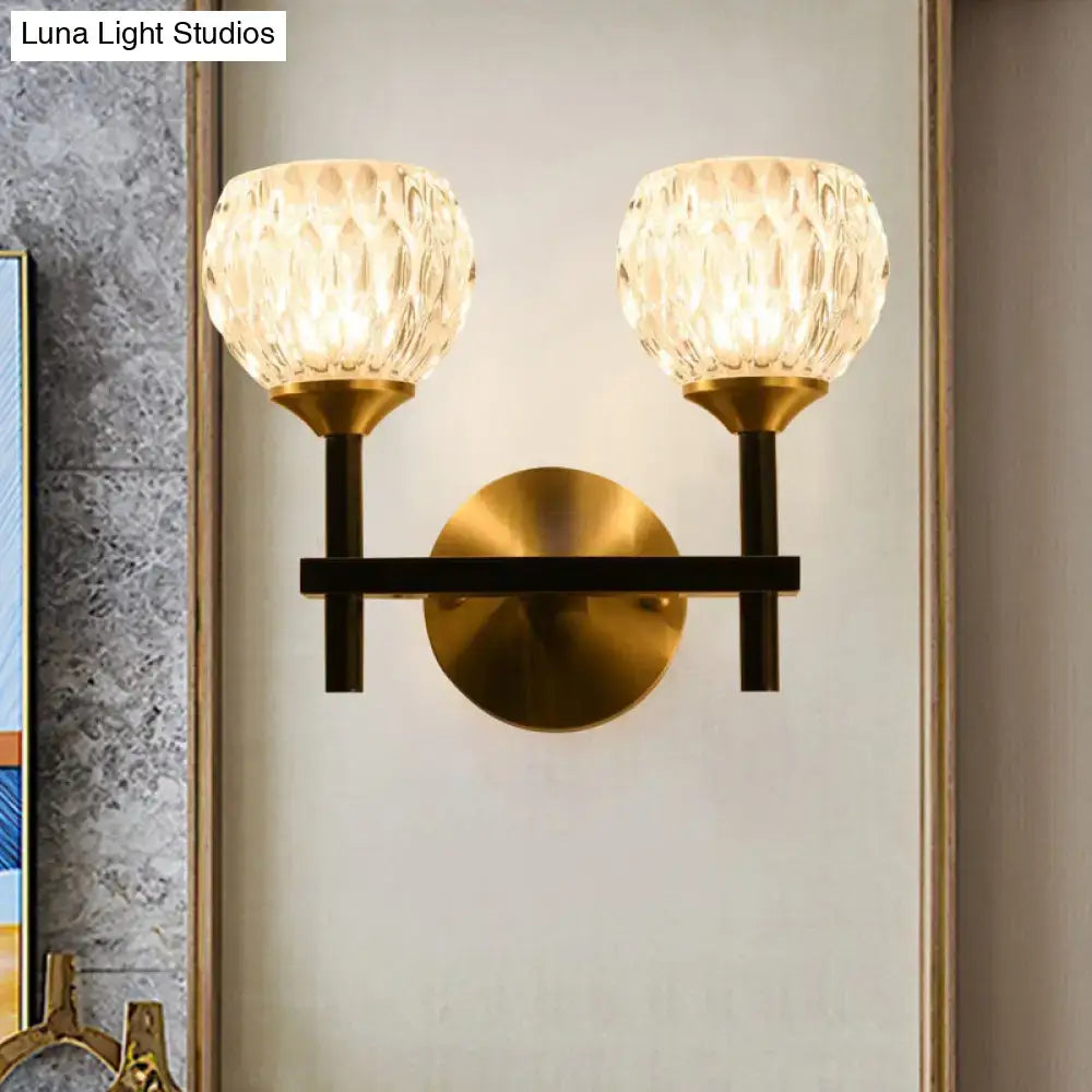 Gold dimpled glass double-light wall sconce by Decorbites with brass finish and black arms on Tampa Home & Garden Store