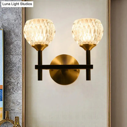 Gold dimpled glass double-light wall sconce by Decorbites with brass finish and black arms on Tampa Home & Garden Store