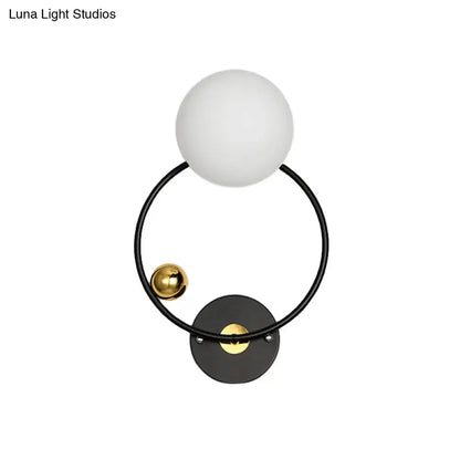 Opal Glass Circular Wall Sconce by Decorbites; frosted globe on black ring with brass accents on Tampa Home & Garden Store