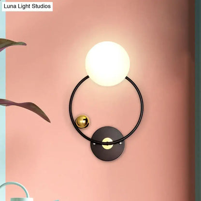 Opal Glass Circular Wall Sconce by Decorbites, black ring frame with opal globe and brass accent on Tampa Home & Garden Store