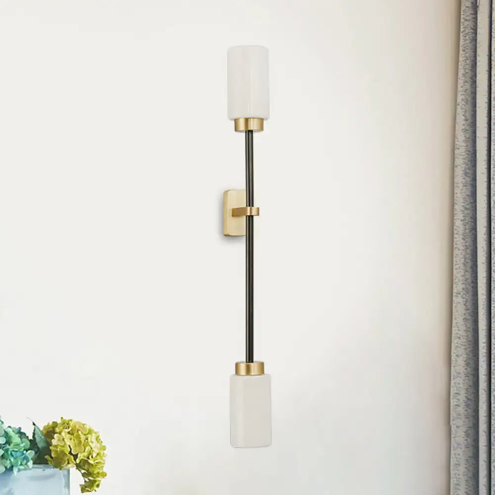 Gold Glass Wall Sconce Dual-Head Tube Shade with brass hardware on a black stem Decorbites on Tampa Home & Garden Store