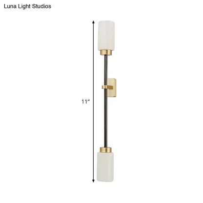 Gold glass wall sconce dual-head tube shade by Decorbites on a slim black wall mount on Tampa Home & Garden Store
