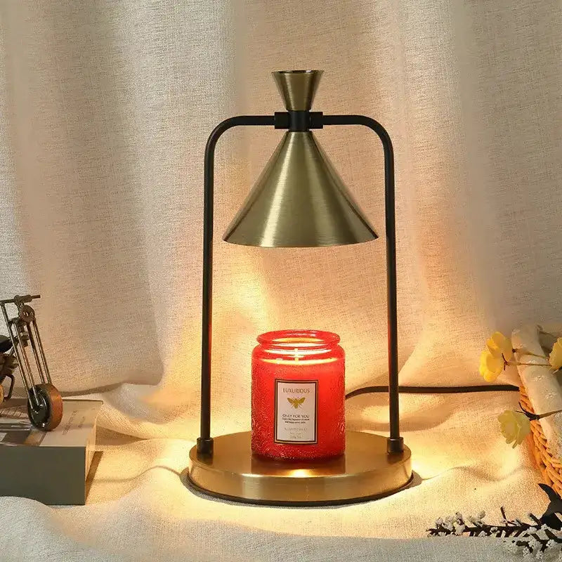 Decorbites candle warmer lamp black metal frame with brass gold shade and red jar candle on Tampa Home & Garden Store