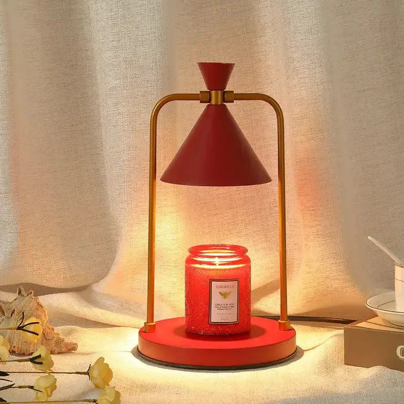 Modern candle warmer lamp with gold frame and red cone shade atop red base Decorbites on Tampa Home & Garden Store