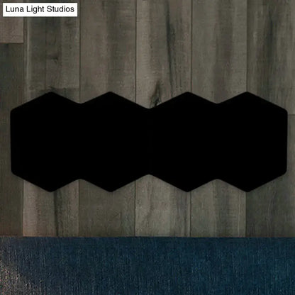 Black hexagon wall sconce by Decorbites; double hexagon silhouette for modern home decor on Tampa Home & Garden Store