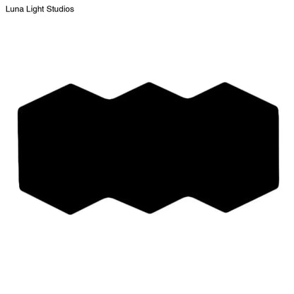 Black hexagon wall sconce for modern home decor on Tampa Home & Garden Store