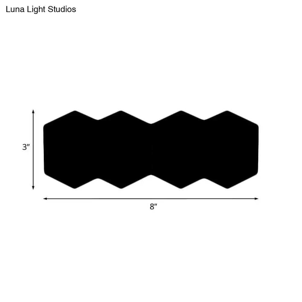 Black hexagon wall sconce with three linked hexagons by Decorbites, 8in wide by 3in high on Tampa Home & Garden Store
