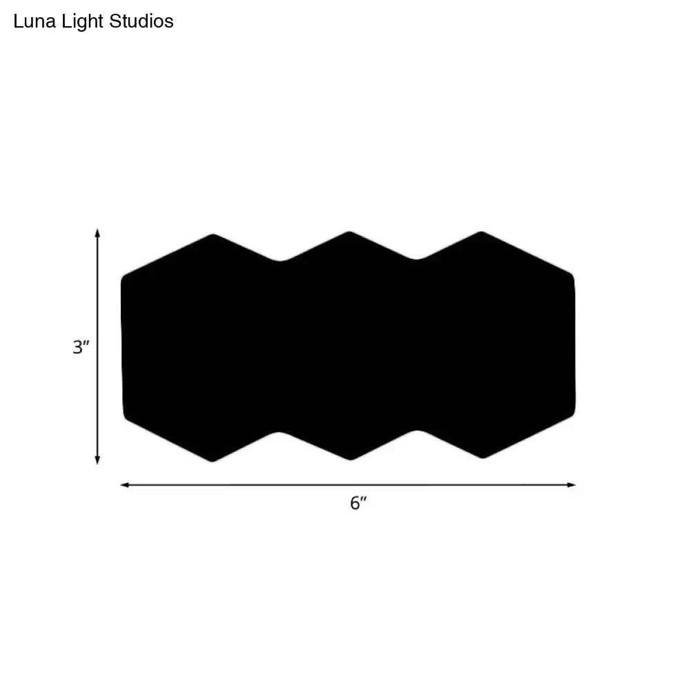 Black hexagon wall sconce with zigzag top edge 6in wide by 3in high on Tampa Home & Garden Store