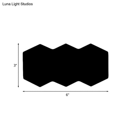 Black hexagon wall sconce with zigzag top edge 6in wide by 3in high on Tampa Home & Garden Store