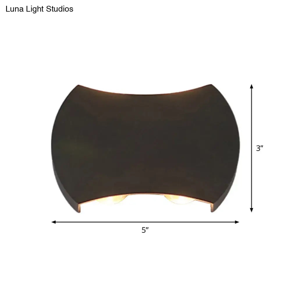 Black LED Wall Washer Decorbites, curved black fixture with warm glow, 5 in wide by 3 in high on Tampa Home & Garden Store