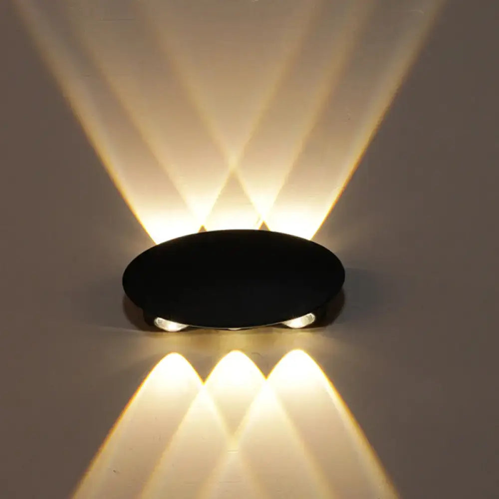 Black Decorbites LED wall washer projecting warm white light up and down on Tampa Home & Garden Store