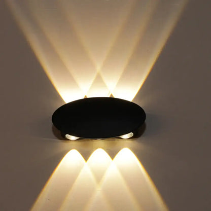 Black Decorbites LED wall washer projecting warm white light up and down on Tampa Home & Garden Store