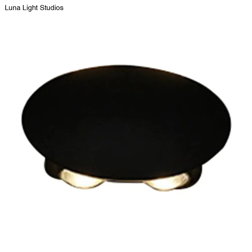Decorbites Black LED Wall Washer, round black fixture with gold-toned feet on Tampa Home & Garden Store