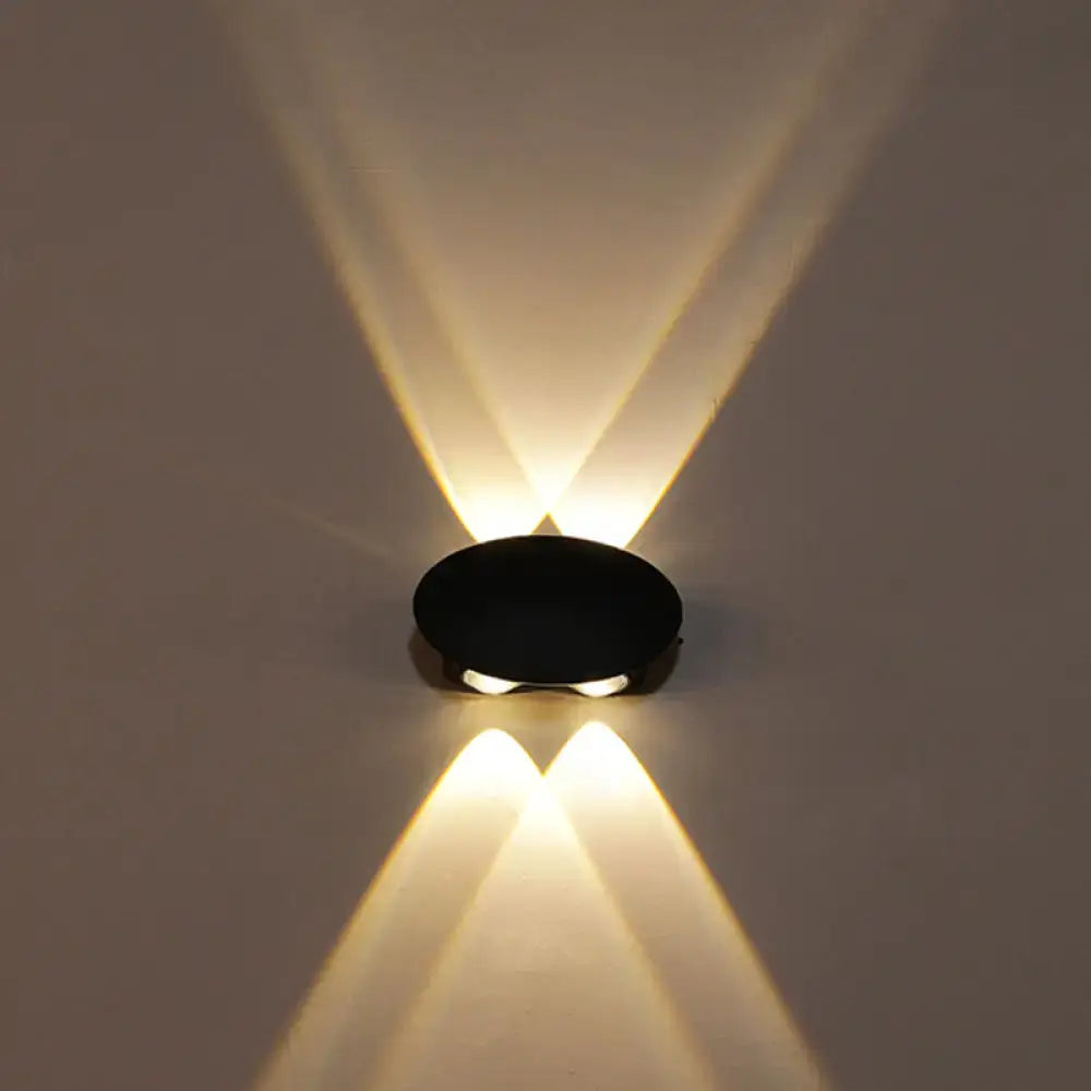 Decorbites Black LED Wall Washer, compact black oval wall fixture casting warm up and down light on wall on Tampa Home & Garden Store