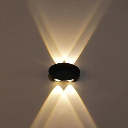 Decorbites Black LED Wall Washer, compact black oval wall fixture casting warm up and down light on wall on Tampa Home & Garden Store