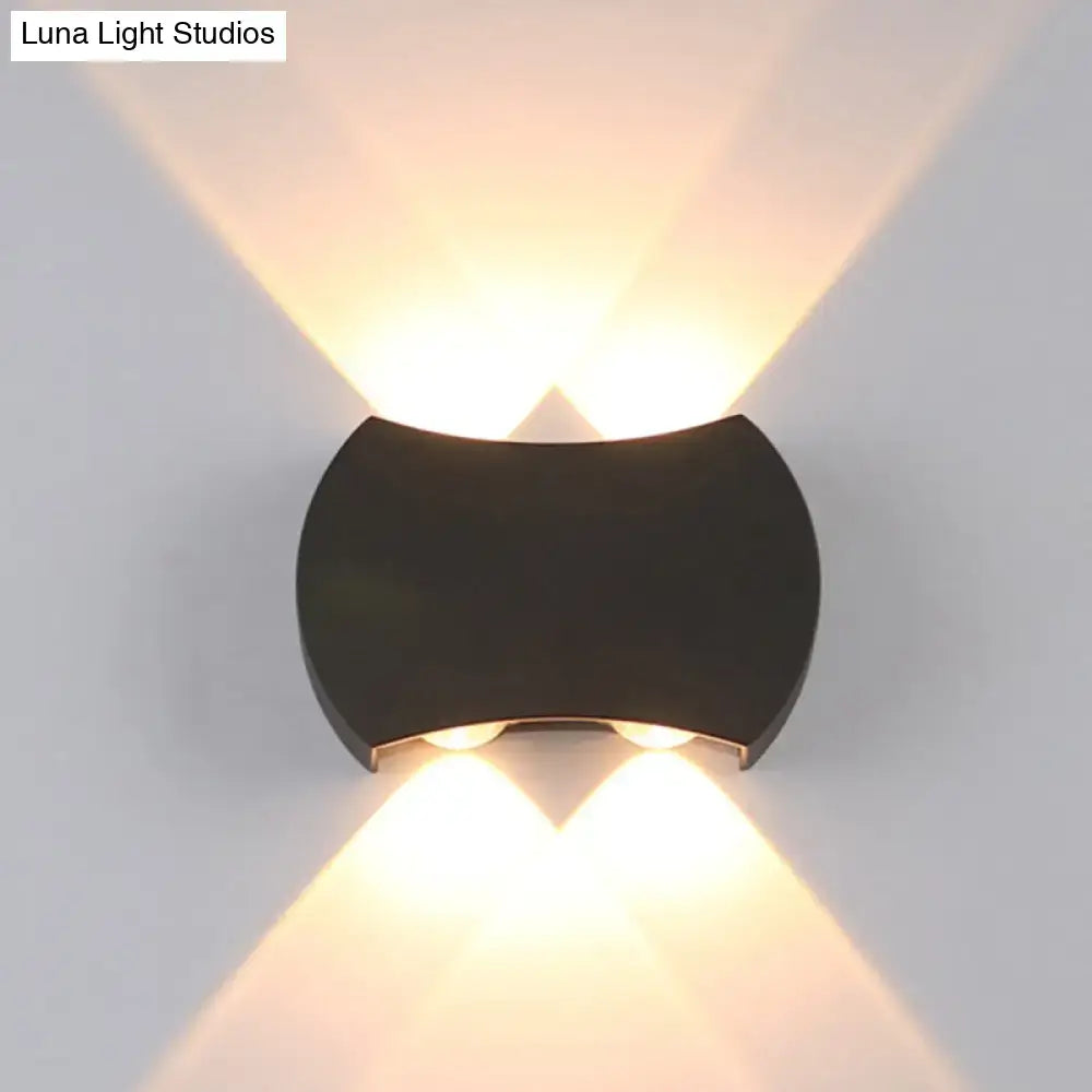 Black LED wall washer fixture by Decorbites with curved housing; warm upward and downward light on Tampa Home & Garden Store