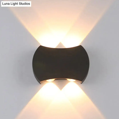 Black LED wall washer fixture by Decorbites with curved housing; warm upward and downward light on Tampa Home & Garden Store