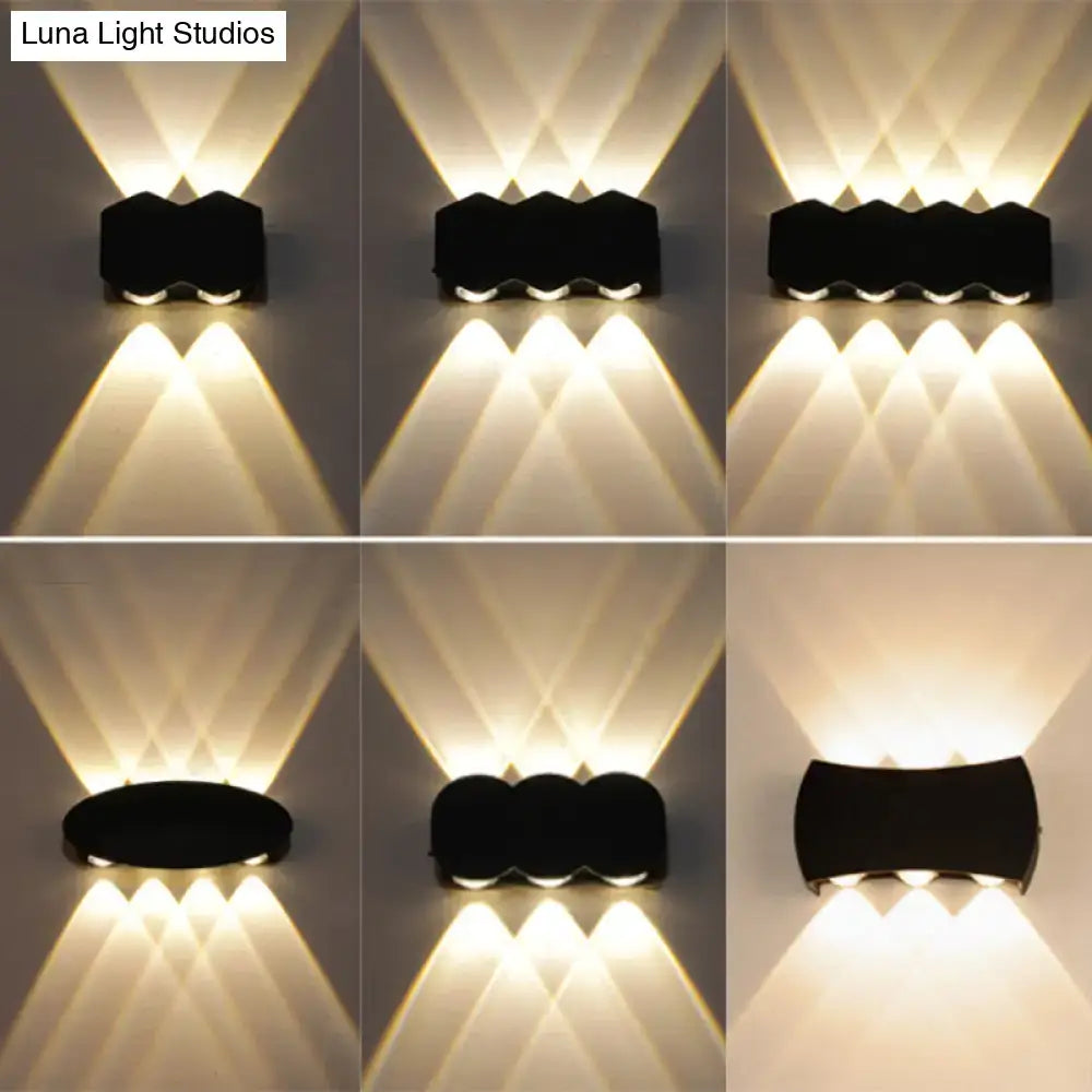 Black LED Wall Washer by Decorbites six-frame wall-mounted fixture casting warm uplight patterns on Tampa Home & Garden Store