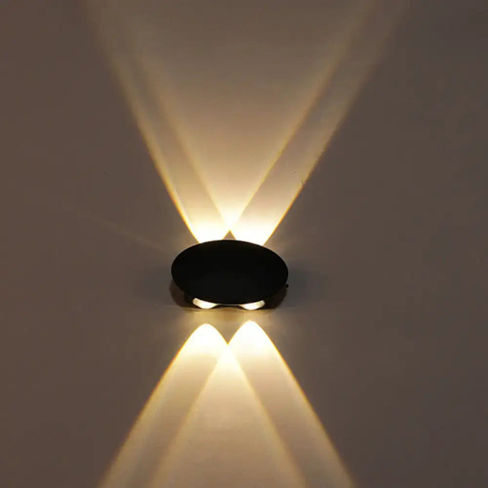 Decorbites black circular LED wall washer wall light casting warm up/down beams on Tampa Home & Garden Store