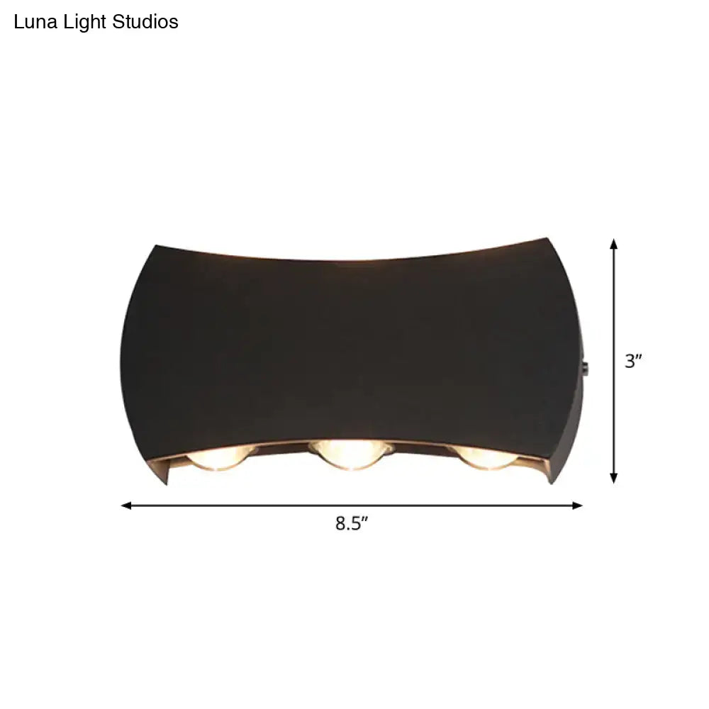 Black LED wall washer by Decorbites with curved housing and three bulbs, 8.5in wide x 3in high on Tampa Home & Garden Store