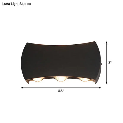 Black LED wall washer by Decorbites with curved housing and three bulbs, 8.5in wide x 3in high on Tampa Home & Garden Store