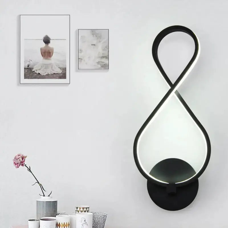 Modern black infinity LED sconce wall light with loop design, wall-mounted by Decorbites on Tampa Home & Garden Store