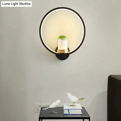Black circular wall sconce with plant vase by Decorbites, LED halo ring and gold base on Tampa Home & Garden Store