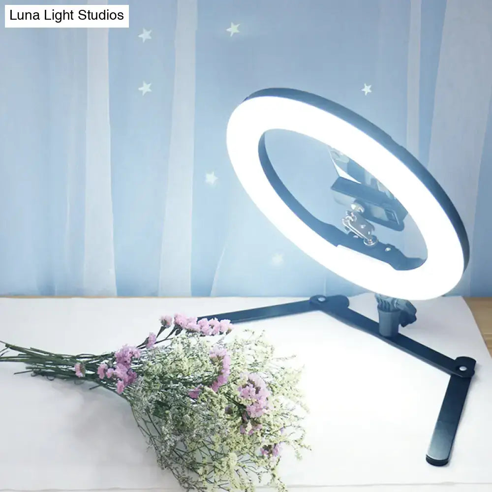 Decorbites Black LED Flash Lamp on adjustable tripod with bright ring glow and bouquet on desk on Tampa Home & Garden Store
