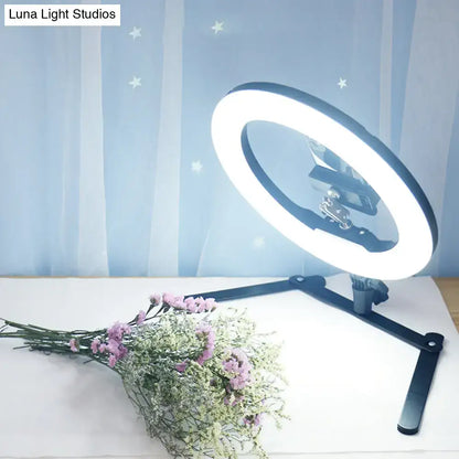 Decorbites Black LED Flash Lamp on adjustable tripod with bright ring glow and bouquet on desk on Tampa Home & Garden Store