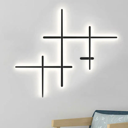 Black Crossed Lines Wall Light by Decorbites, geometric black metal LED wall sconce with glow on Tampa Home & Garden Store