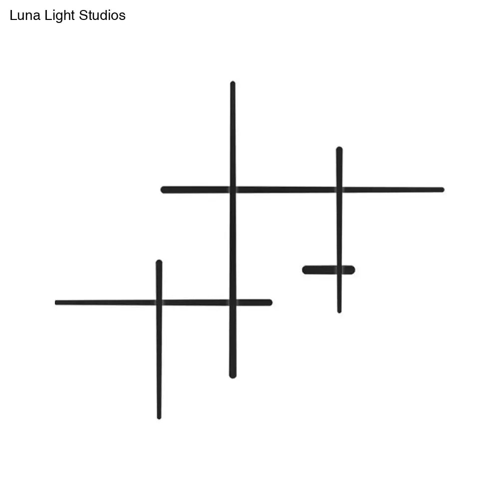 Black Crossed Lines Wall Light by Decorbites, black metal wall fixture with intersecting rods on Tampa Home & Garden Store