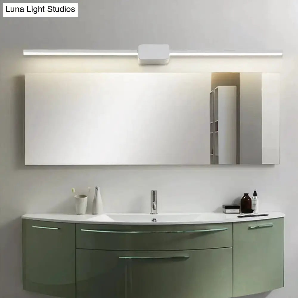 Decorbites modern black linear LED bathroom vanity sconce above a mirror with green vanity on Tampa Home & Garden Store