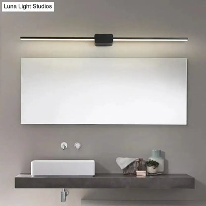 Black linear LED bathroom vanity light sconce mounted above mirror for modern bathroom on Tampa Home & Garden Store