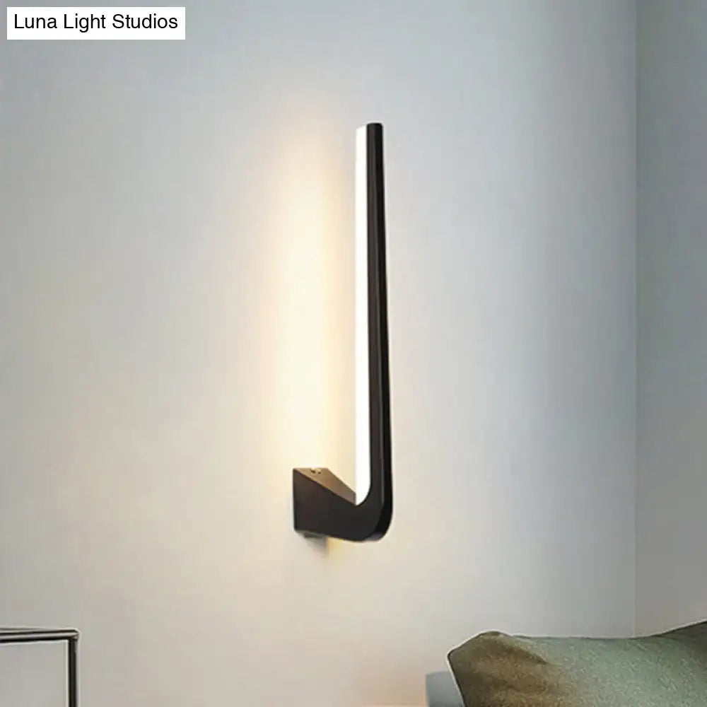 Black direct-wired metal sconce with a slim vertical integrated LED light mounted on wall on Tampa Home & Garden Store