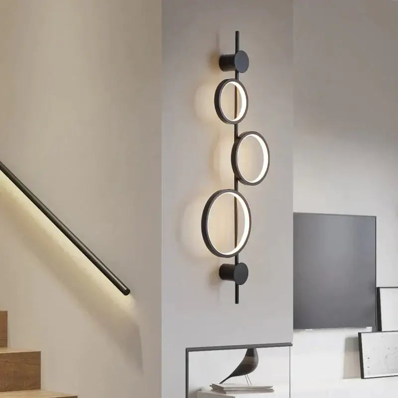 Black long wall sconce by Decorbites with circular ring lights on Tampa Home & Garden Store