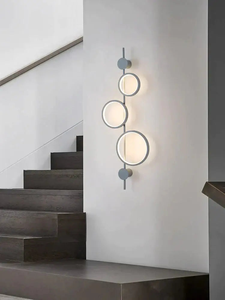 Black Long Wall Sconce with three illuminated circular rings in metal, modern wall light on Tampa Home & Garden Store