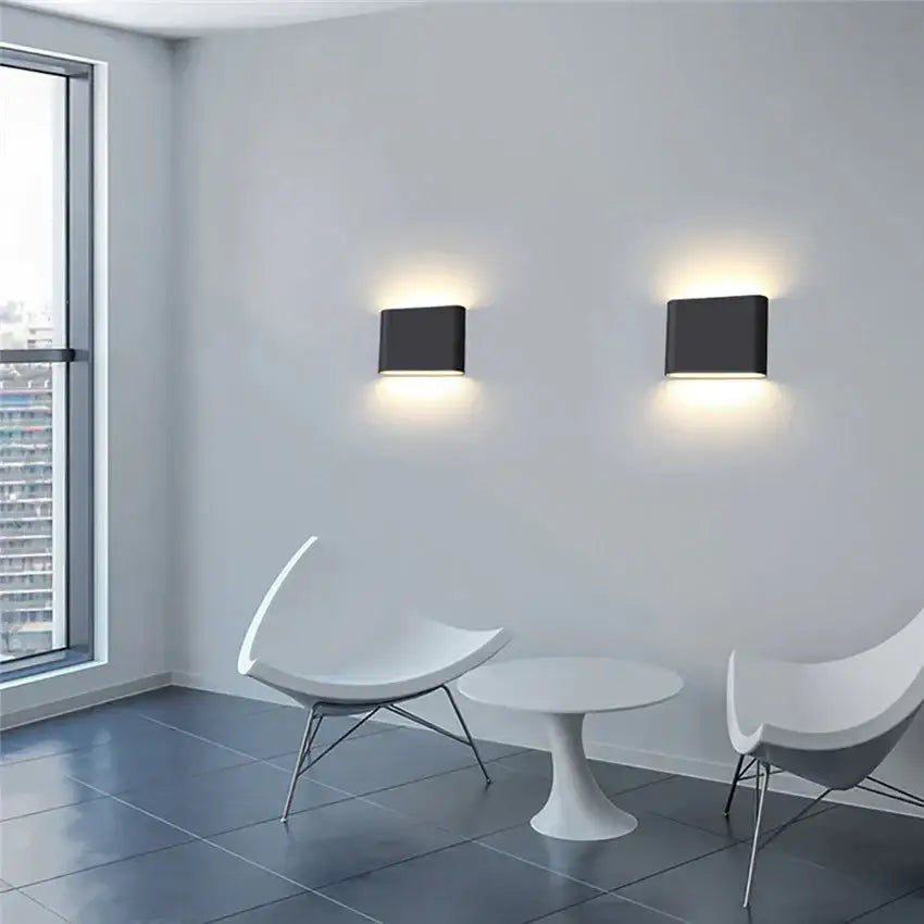Decorbites black outdoor wall light pair; modern square wall sconces with warm glow on Tampa Home & Garden Store