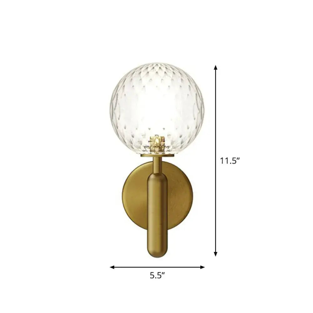 Decorbites brass sconce with clear glass globe, gold finish on Tampa Home & Garden Store