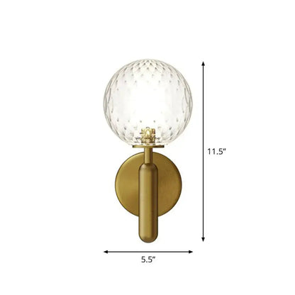 Decorbites brass sconce with clear glass globe, gold finish on Tampa Home & Garden Store
