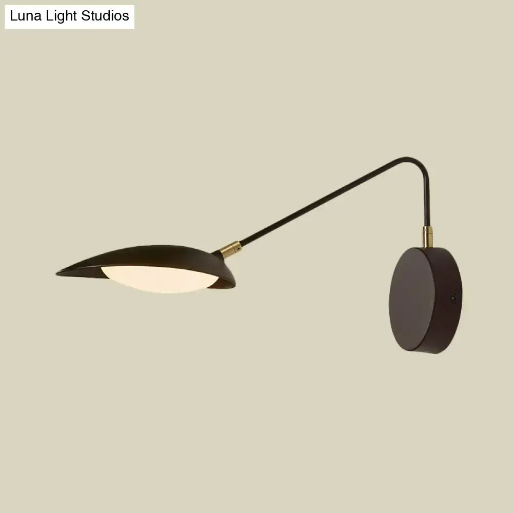 Black adjustable oval reading lamp by Decorbites; wall-mounted with curved arm and base on Tampa Home & Garden Store